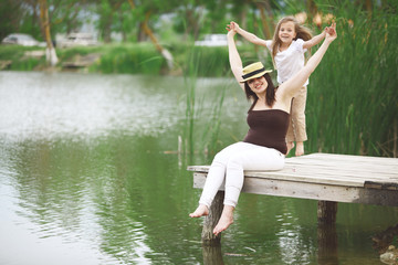 Wall Mural - Family resting near pond