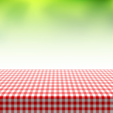Picnic Table Covered With Checkered Tablecloth