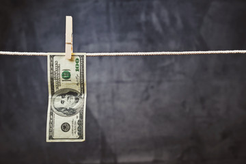 American Dollars hanging on rope