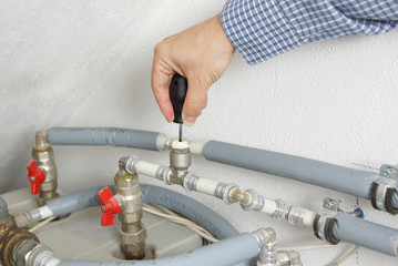 Wall Mural - Technician fixing central heating system