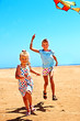 © Gennadiy Poznyakov - Kid flying kite outdoor.