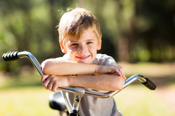 Wall Mural - cute little boy on a bicycle