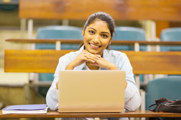 Wall Mural - cute indian college student in lecture room