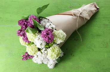 Sticker - Beautiful bouquet of spring flowers on color wooden background