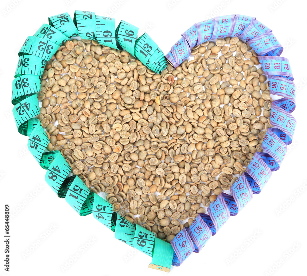 Raw green coffee beans and measuring tape, isolated