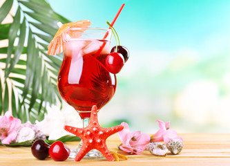 Canvas Print - Refreshing cherry cocktail on beach table