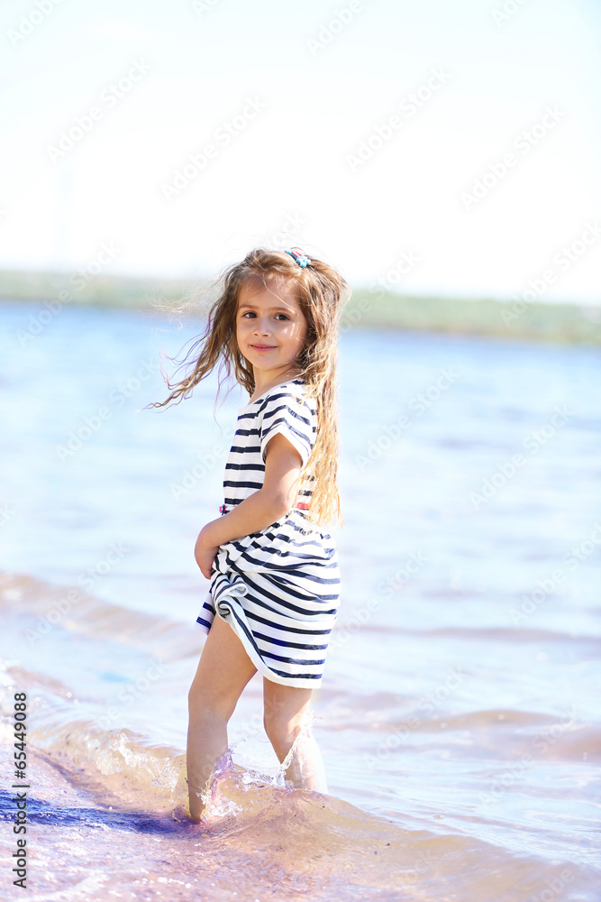 Beautiful little girl on the beach