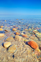 Canvas Print - Fresh ocean water with coastal stones. Polish Baltic Sea coast