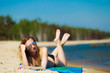 © Voyagerix - Summer vacation Girl in bikini sunbathing on beach