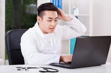 Wall Mural - Asian doctor during work