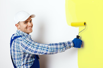 Painter painting a wall