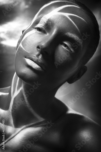 Fototapeta na wymiar Beautiful african-american young brunette model with art make-u