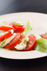 Canvas Print - Tomato and mozzarella with basil leaves