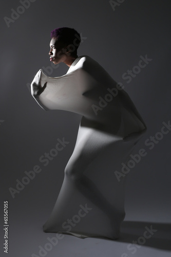 Valokuva Shapely Woman in Creative Light and Spandex Fabric