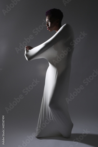 Valokuva Shapely Woman in Creative Light and Spandex Fabric