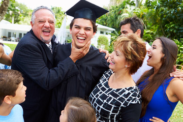 Wall Mural - Hispanic Student And Family Celebrating Graduation