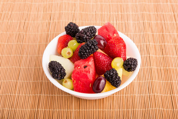 Wall Mural - Berries Melons and Grapes in White Bowl