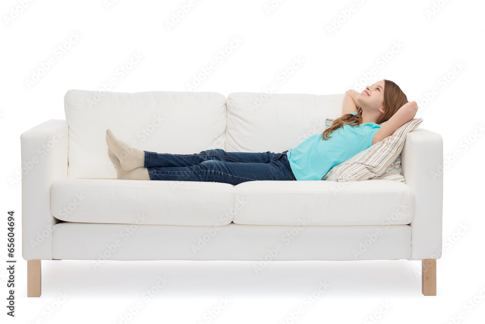smiling little girl lying on sofa Stock Photo | Adobe Stock