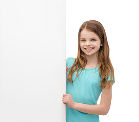 Canvas Print - happy little girl with blank white board