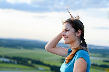 Wall Mural - healthy cheerful young woman outdoor in beautiful landscape