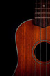 © artpritsadee - Ukulele hawaiian guitar over dark background.