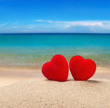 Two Red Hearts In The Sand