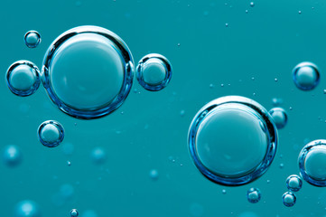 Wall Mural - Air bubbles in a liquid. Abstract blue background. Macro