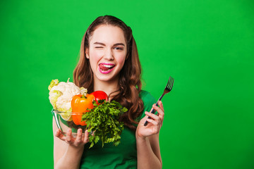 beautiful woman holding vegetables for salad