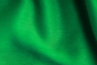 green background abstract cloth wavy folds of textile texture