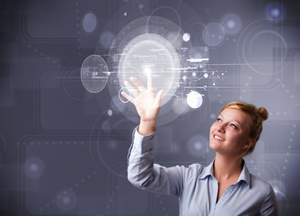 Wall Mural - Attractive businesswoman touching abstract high technology circu