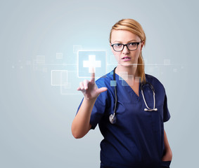 Wall Mural - Young nurse pressing modern medical type of buttons