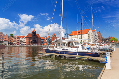 Fototapeta na wymiar The medieval port crane over Motlawa river in Gdansk, Poland