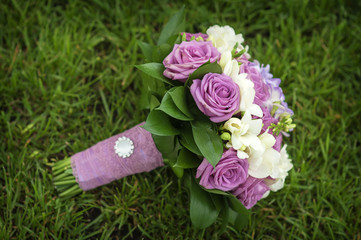 Wedding Bouquet of flowers lying on green grass