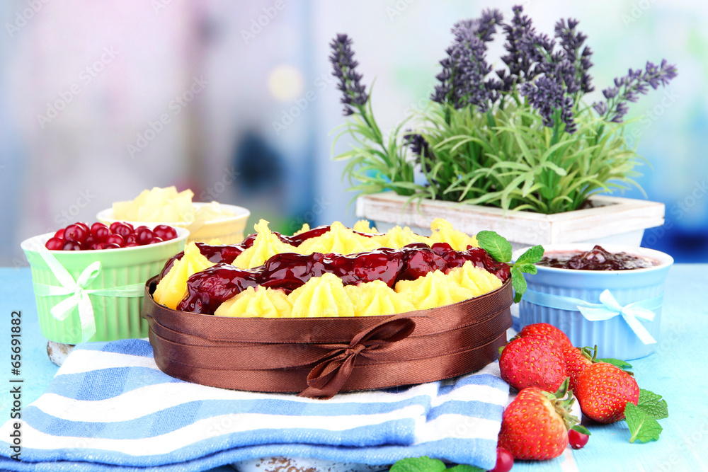 Tasty fruity homemade pie with berries, on table