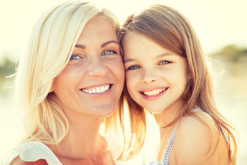 Canvas Print - happy mother and child girl