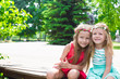 © travnikovstudio - Happy adorable little girls enjoy warm summer day