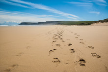Footprints Of Hiking Boots On The Sand Of A Remote Beach In Scot