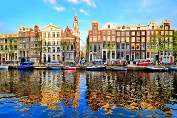 Sticker - Canal houses of Amsterdam at dusk with vibrant reflections