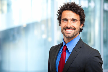 Wall Mural - Handsome smiling businessman