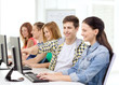 © Syda Productions - female student with classmates in computer class