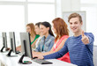 © Syda Productions - male student with classmates in computer class