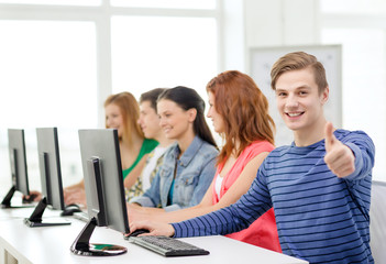 Wall Mural - male student with classmates in computer class