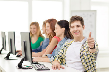 Wall Mural - male student with classmates in computer class