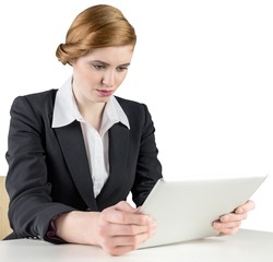 Poster - Redhead businesswoman using her tablet pc