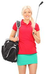 Poster - Woman holding a golf club and carrying a bag