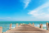 Fototapeta Fototapety z morzem do Twojej sypialni - Wooden jetty with blue sky