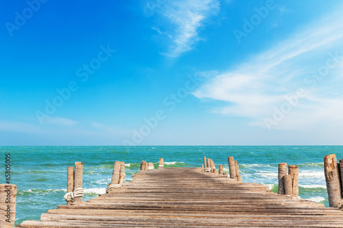 Fototapeta na wymiar Wooden jetty with blue sky