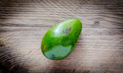 Wall Mural - Avocado on the wooden background