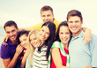 © Syda Productions - group of friends having fun on the beach