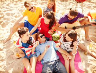 Wall Mural - group of friends having fun on the beach